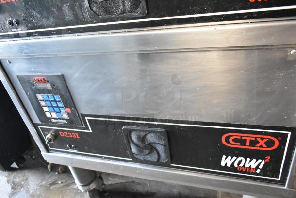 Middleby Marshall CTX DZ33I stainless steel conveyor pizza oven, 208 volts, on casters, digital controls visible.