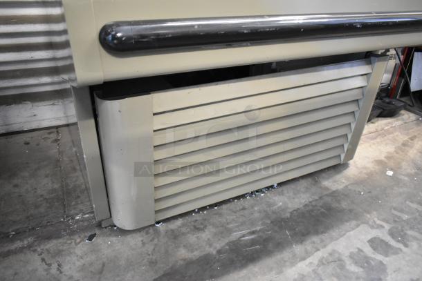 Hussmann GSVM-4060 commercial reach-in merchandiser, metal shelves, 115V, 1 phase, good condition, floor-style unit.
