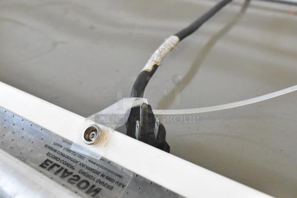 Hussmann GSVM-4060 commercial merchandiser plug and label detail, showing power connection and specifications.