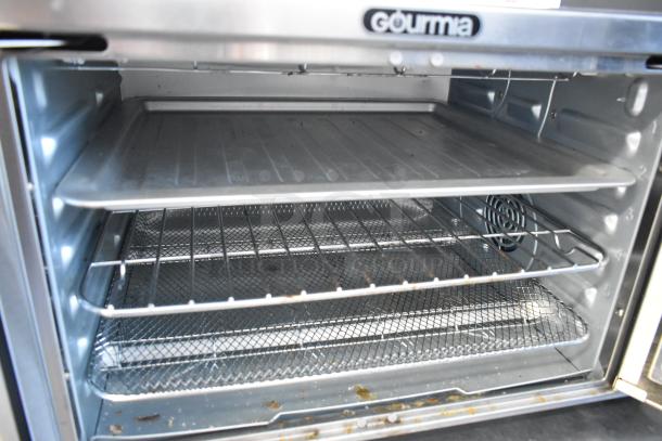 Gourmia GTF7660 Digital Air Fryer Oven, metal finish, shows interior with trays and fan. Model label visible. Good condition.
