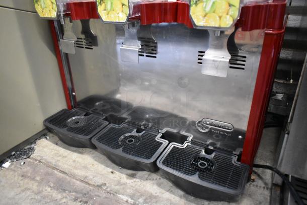 Commercial 3-hopper refrigerated beverage machine, metal countertop design, 115 volts, 1 phase, drainage trays visible.