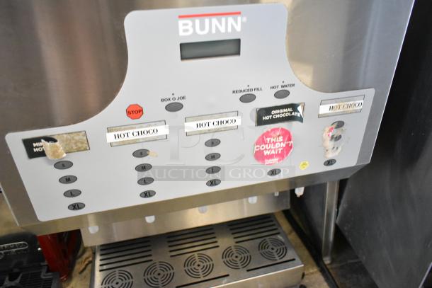 Bunn IMIX-5 stainless steel commercial cappuccino machine, multiple drink options, visible labels. Model features durable build.
