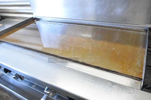 Cook Rite ATO-48G2B stainless steel flat top griddle, 2 burners, 2 ovens, over shelf, back splash, on casters.