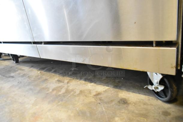Cook Rite ATO-48G2B stainless steel griddle with 2 burners, 2 ovens, over shelf, backsplash, on commercial casters.