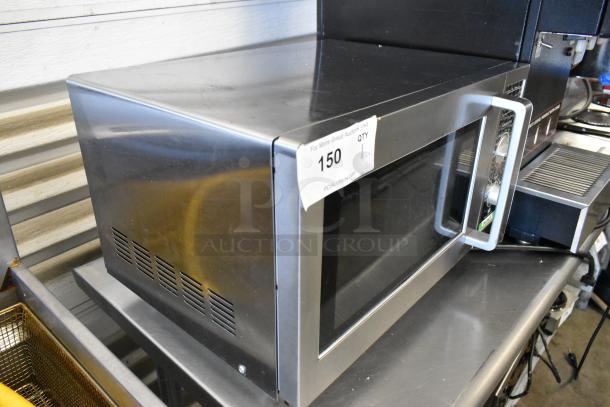 Spectrum EMW-1000SD stainless steel commercial countertop microwave oven, 120V, used, visible auction label.
