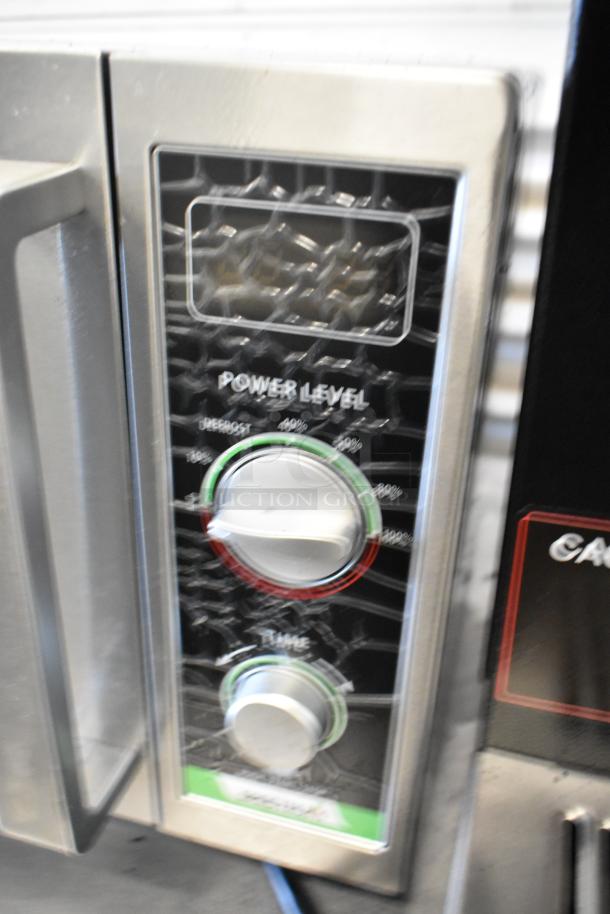 Spectrum EMW-1000SD stainless steel commercial microwave, visible power and timer knobs, 120 volts, 1 phase.