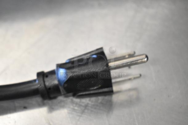 Close-up of the power plug for Spectrum EMW-1000SD commercial microwave oven, indicating 120 Volts, 1 Phase.