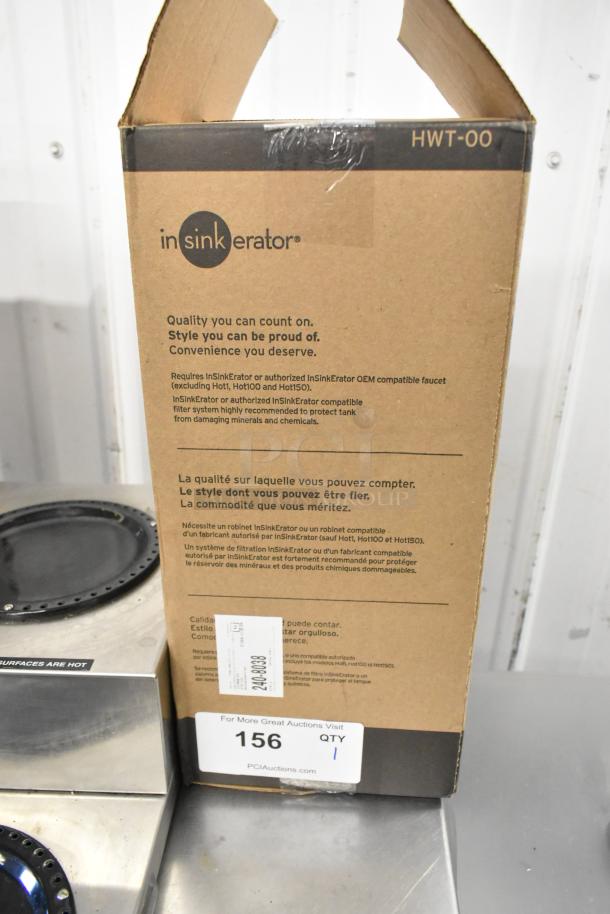 Insinkerator HWT Instant Hot Water Tank in original packaging. Packaging shows model HWT-00 with multilingual details.