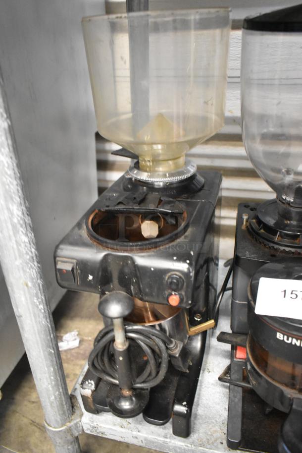 Two metal commercial countertop espresso bean grinders, including Bunn ES-1G and Bregani models, 115 volts, 1 phase.