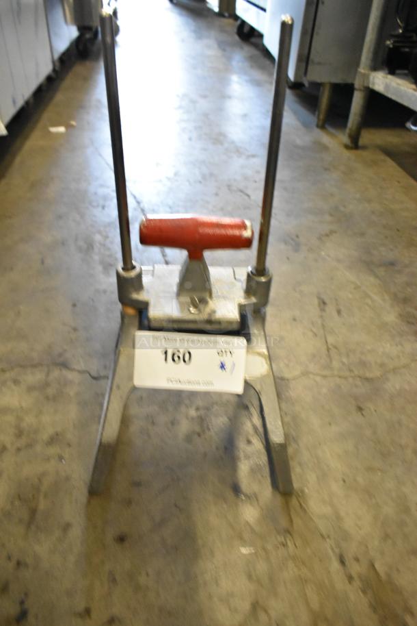Redco Metal Countertop Vegetable Cutter with red handle, metal frame, and auction tag marked "160." In used condition.