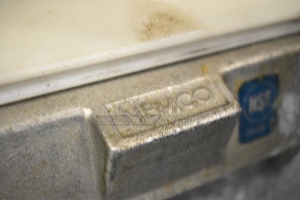 Nemco Metal Countertop Tomato Slicer, features visible Nemco branding and NSF certification mark, well-used condition.