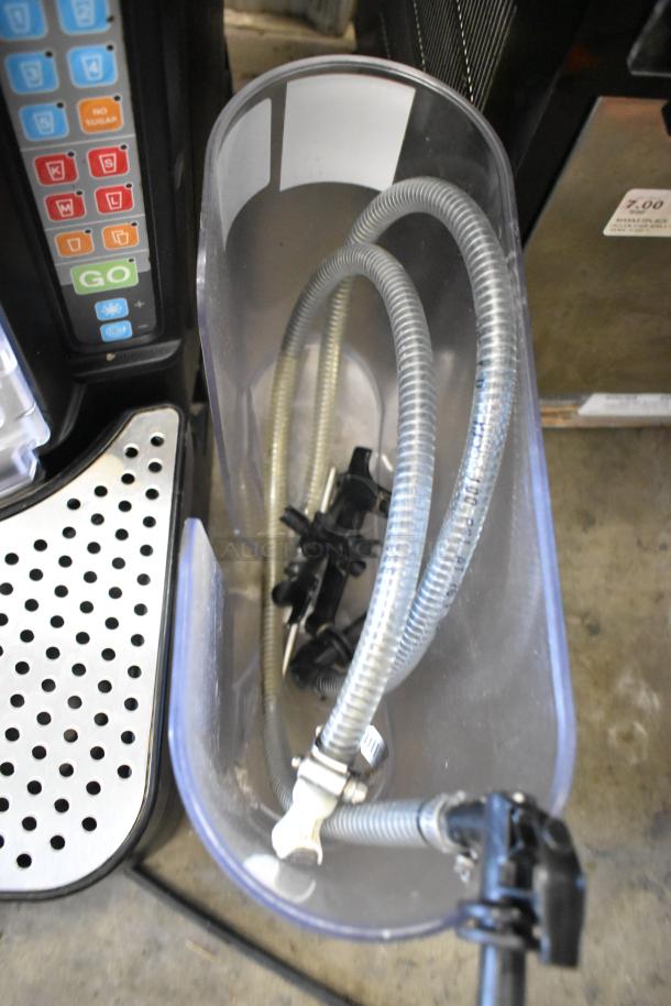 Taylor X83684-12 frozen drink mixing station, metal, commercial countertop, features control panel and hose components.