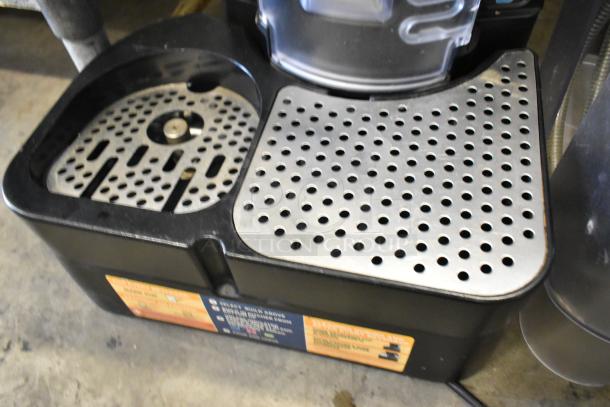 Taylor X83684-12 metal commercial frozen drink mixing station. Features perforated metal top, appears in used condition.