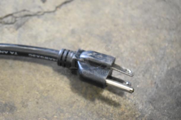 2020 SPM Frosty 2 New Slushie Machine plug detail; black cord, standard two-prong plug.