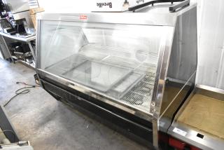 McCray metal deli display case, commercial floor style, 115 volts, 1 phase, showcases open glass front with metal shelving.