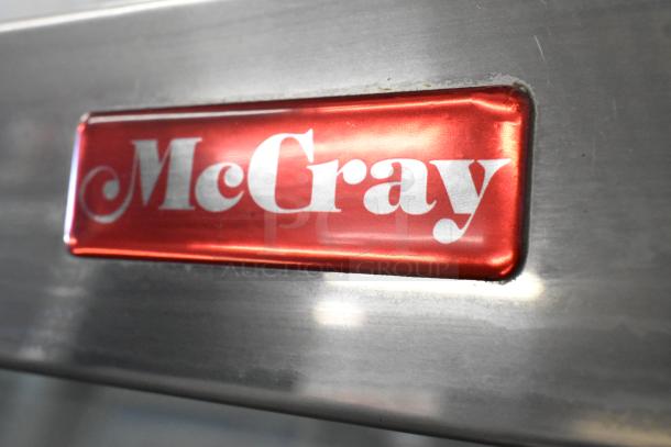 McCray Metal Commercial Deli Display Case, red McCray logo, 115 Volts, 1 Phase, sturdy floor style.