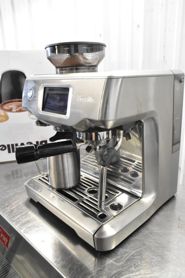 Breville metal countertop single group espresso machine with bean hopper and portafilter; sleek design, good condition.