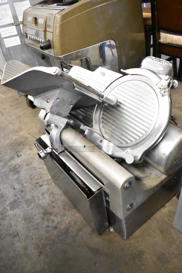 Globe 715 metal commercial countertop meat slicer with blade sharpener, 115 volts, 1 phase, used condition.