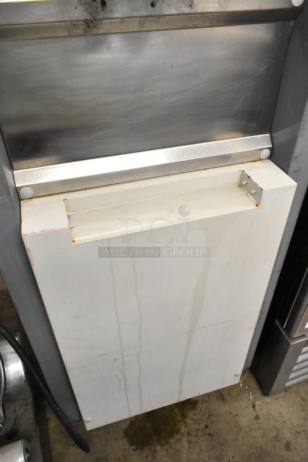 Alpine OP238EC metal soft serve ice cream machine on commercial casters, showing exterior wear, 115 volts, 1 phase.