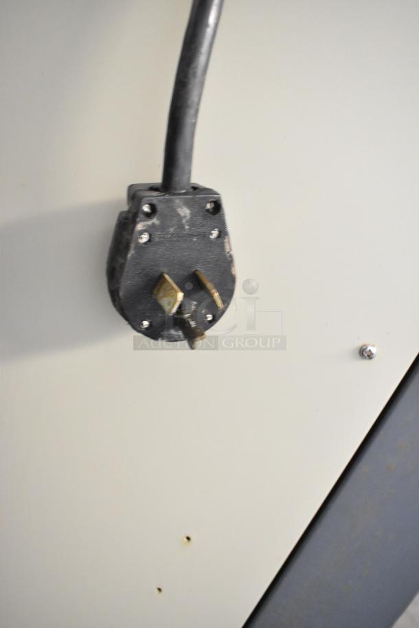 Alpine OP238EC metal soft serve ice cream machine plug and socket, indicating 115 volts, 1 phase connection.