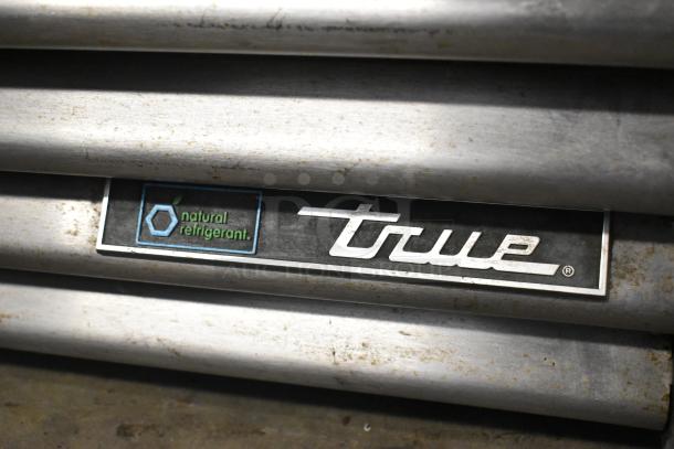 2018 True GDM-26-HC commercial cooler tag showing "True" logo and "natural refrigerant" label.