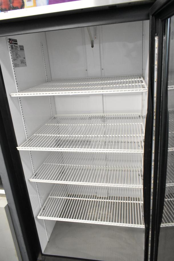2018 True GDM-26-HC metal single door cooler, poly coated racks, 115V, 1 phase; interior and label visible.