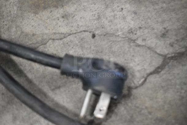 2018 True GDM-26-HC cooler power cord on concrete, 115 volts, single phase.