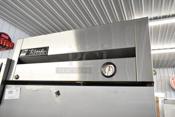True T-23F stainless steel single door reach-in freezer, commercial casters, thermometer gauge, model label visible.