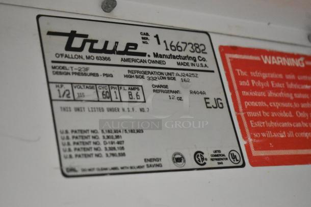 True T-23F Freezer label detailing model, voltage 115, phase 1, refrigerant R404A, NSF and UL certified.
