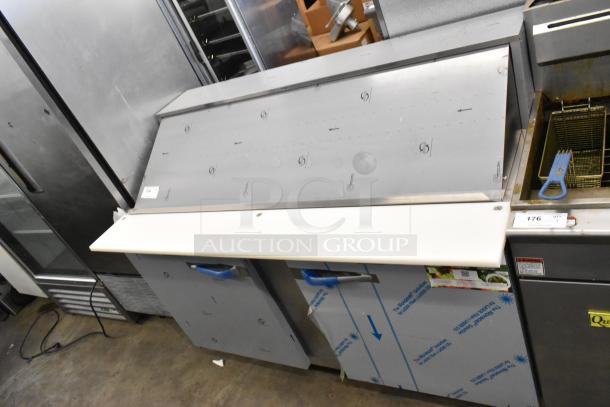 Stainless steel Traulsen UPT6024-LR prep table, 2020 model, commercial casters, scratch and dent condition, 115V, 1 Phase.