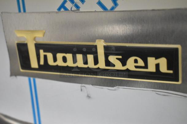 Traulsen logo on stainless steel surface of a 2020 UPT6024-LR prep table. Item is new with scratch and dent.