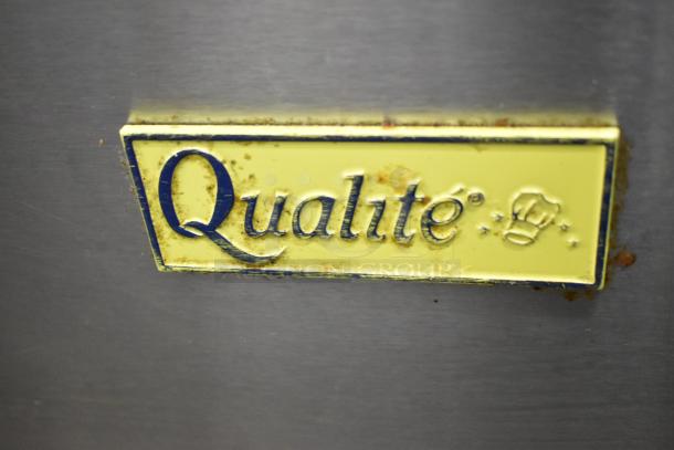 Qualite QL-9/NG stainless steel commercial natural gas fryer with 2 metal baskets, 90,000 BTU. Brand plaque visible.