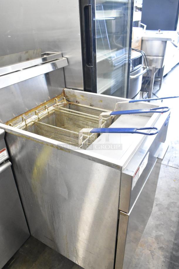 Cook Rite ATFS-75 stainless steel commercial deep fat fryer with 3 metal baskets, on casters. Natural gas, 170,000 BTU.