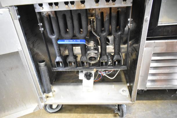 Cook Rite ATFS-75 deep fat fryer, stainless steel, gas-powered, 170,000 BTU, with 3 fry baskets, on commercial casters.