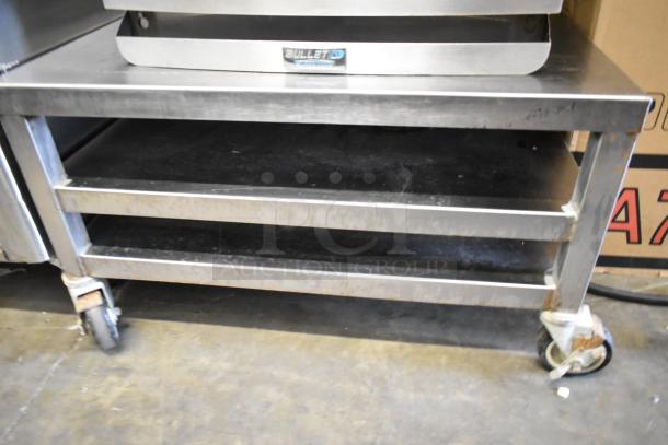 2017 Turbochef Encore2 stainless steel rapid cook oven on equipment stand, 208/240V, 1 phase. Visible wear on wheels.