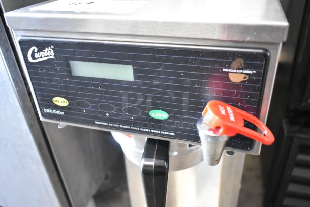 Curtis D500GT12A000 stainless steel commercial coffee machine with hot water dispenser, digital display, metal brew basket.