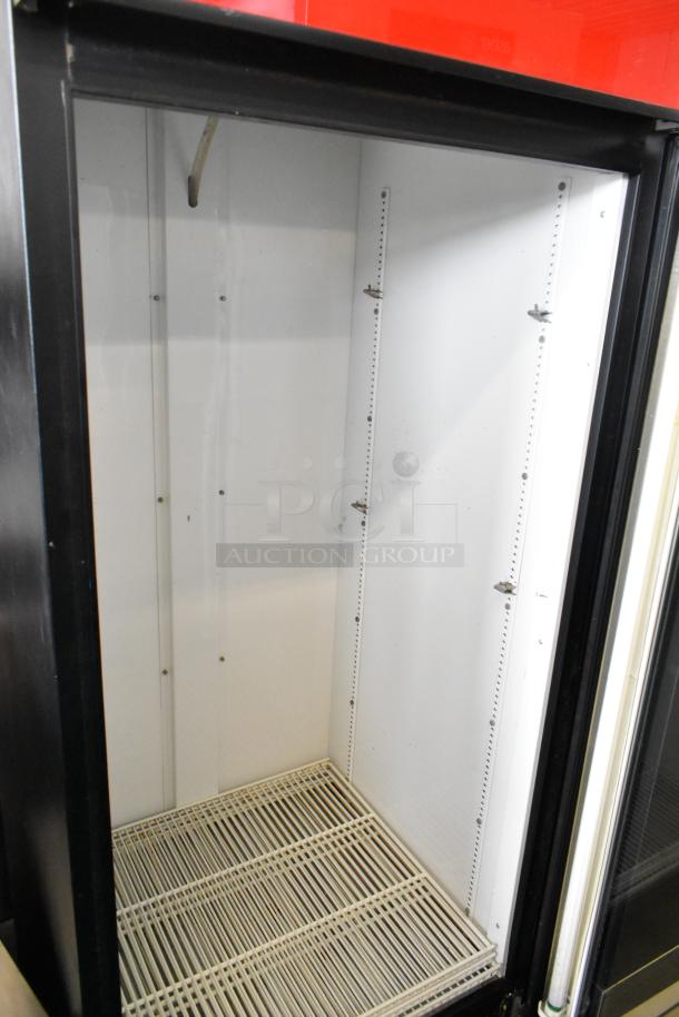 True GDM-26 commercial cooler, single door, metal frame, poly-coated racks, 115 volts, 1 phase, interior view.