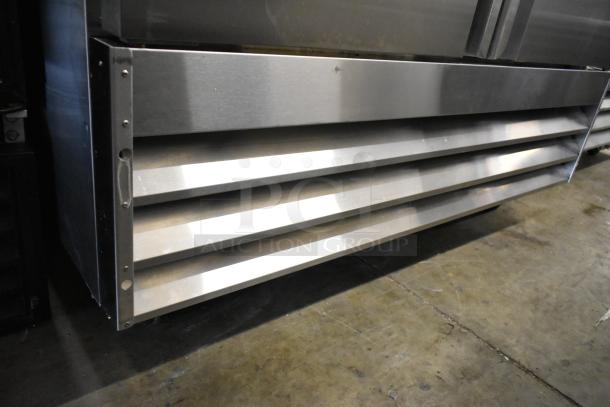 Avantco 178SS2FHC stainless steel 2-door reach-in freezer with poly-coated racks, commercial casters, 115V, 1 phase.