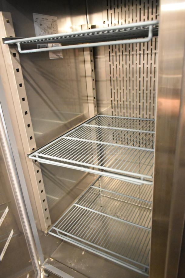 Avantco 178SS2FHC stainless steel 2-door reach-in freezer with poly-coated racks and commercial casters, 115V, 1 phase.