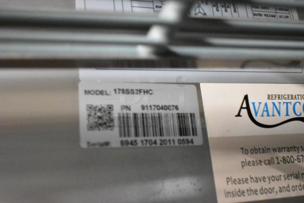 Avantco 178SS2FHC stainless steel commercial 2-door reach-in freezer, poly coated racks, barcode and model label displayed.