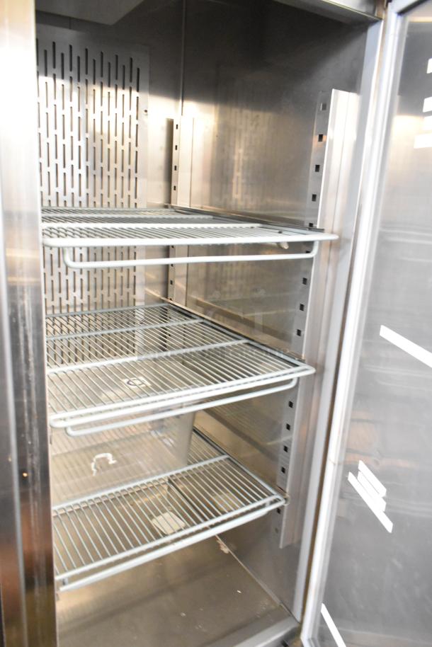 Avantco 178SS2FHC stainless steel commercial 2-door freezer with poly-coated racks and commercial casters, 115 volts, 1 phase.