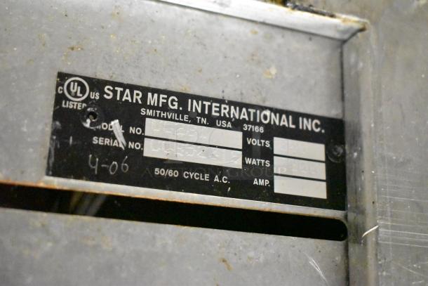 Label on Star Pro Max UG281 Stainless Steel Commercial Double Panini Press showing voltage and wattage details.