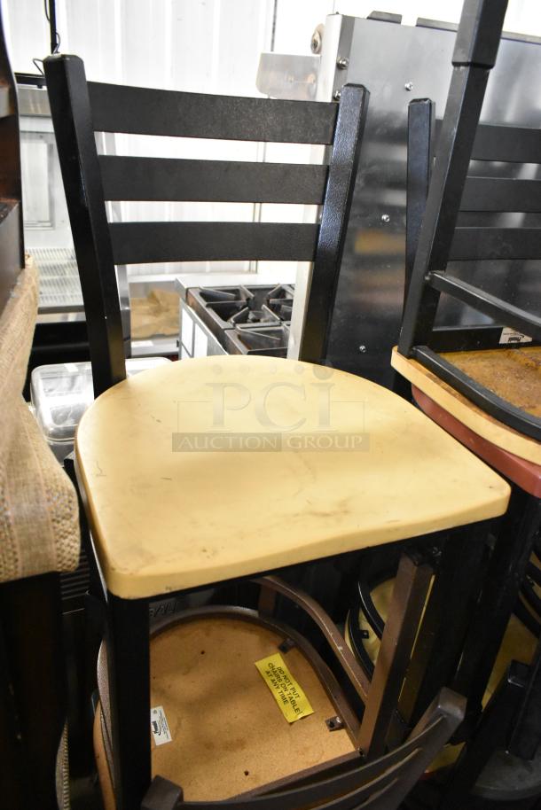 19 mixed chairs including high chair, bar, and dining height in varied condition. Yellow seat visible. Label below reads "DO NOT PUT TABLE ON CHAIR AT ANYTIME."