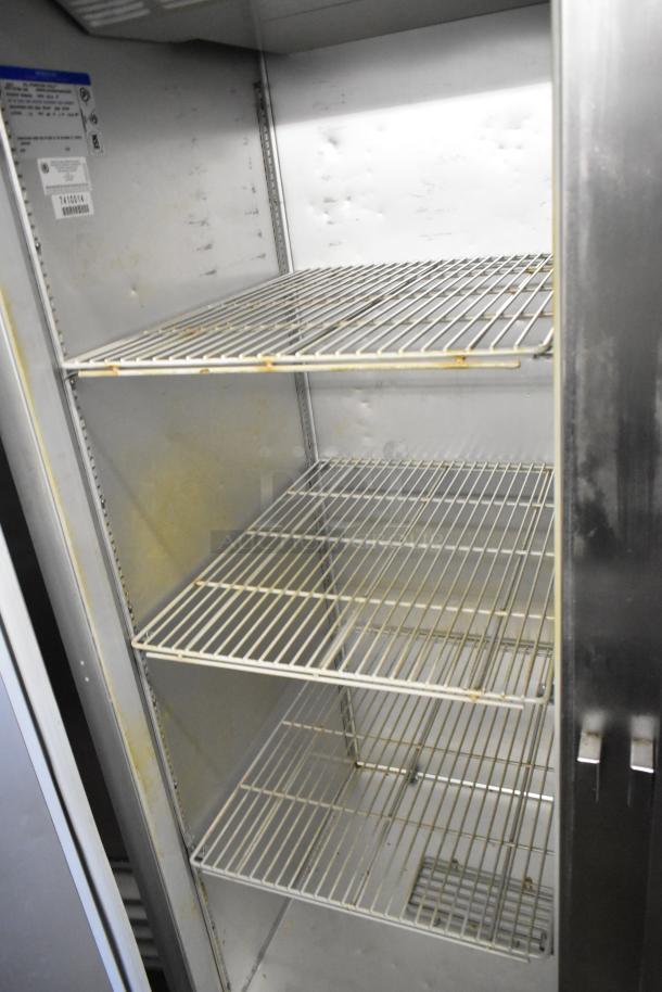 Beverage Air EF48-1AS commercial freezer, stainless steel, poly-coated racks, on casters, viewed open with interior shelves.