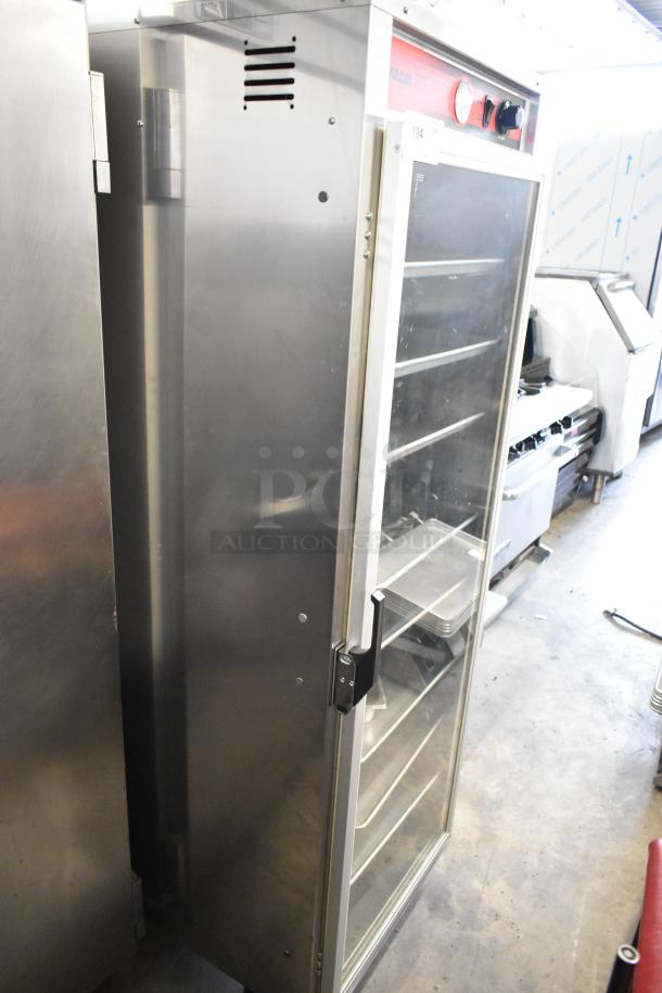 Vulcan VP18 metal commercial heated holding proofing cabinet on casters. 120 volts, 1 phase, glass door, shelves visible.