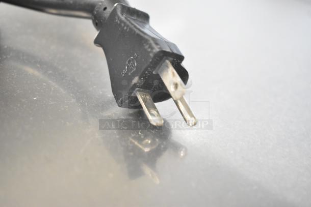 A close-up of a standard three-prong electrical plug for a Vulcan VP18 commercial holding cabinet, 120 volts.