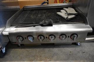 APW Wyott HCRB-2436i stainless steel commercial natural gas charbroiler, 120,000 BTU, with control knobs and grill brush.