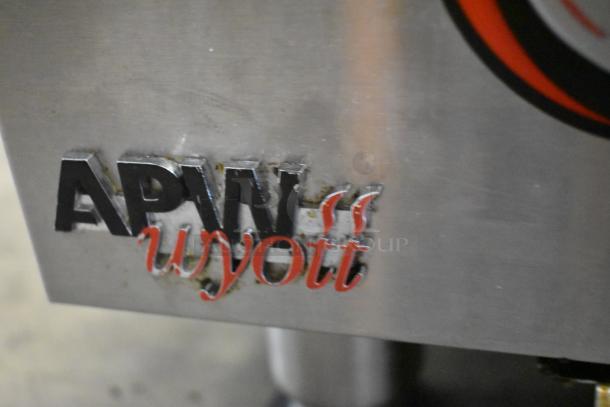 APW Wyott HCRB-2436i charbroiler logo on stainless steel surface, indicating brand and durability.