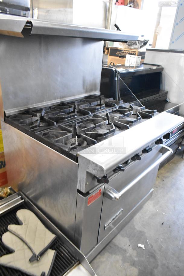 American Range stainless steel commercial 6-burner gas range with oven, overhead shelf, backsplash, excellent condition.