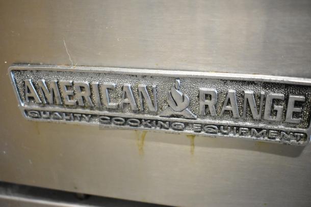 American Range stainless steel label on commercial gas-powered 6 burner range. Features oven, over shelf, and backsplash.